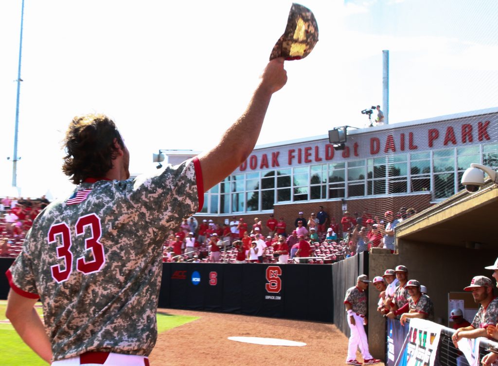 Johnny Piedmonte (33) comes back out to ti his cap to the fans. NC State routed Navy 17-1 to stay alive in the Raleigh Regional on June 5, 2016. (Photo by: Jerome Carpenter/WRAL contributor)
