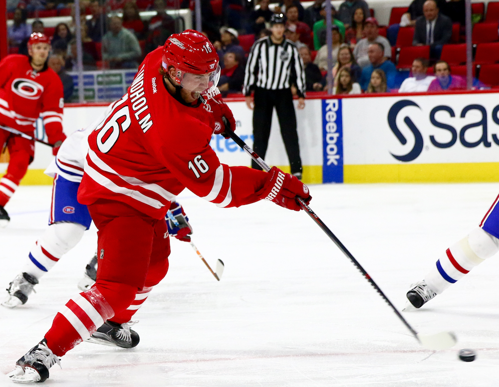 Elias Lindholm (16) rips off a shot. The Carolina Hurricanes defeated the Montreal Canadiens, by a score of 3-2, on November 18, 2016 in Raleigh, North Carolina. (Jerome Carpenter/WRAL Contributor)